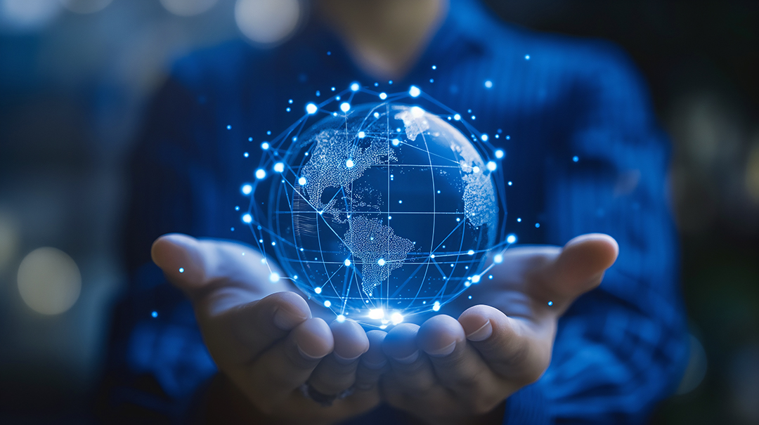 Two open hands holding a glowing network globe